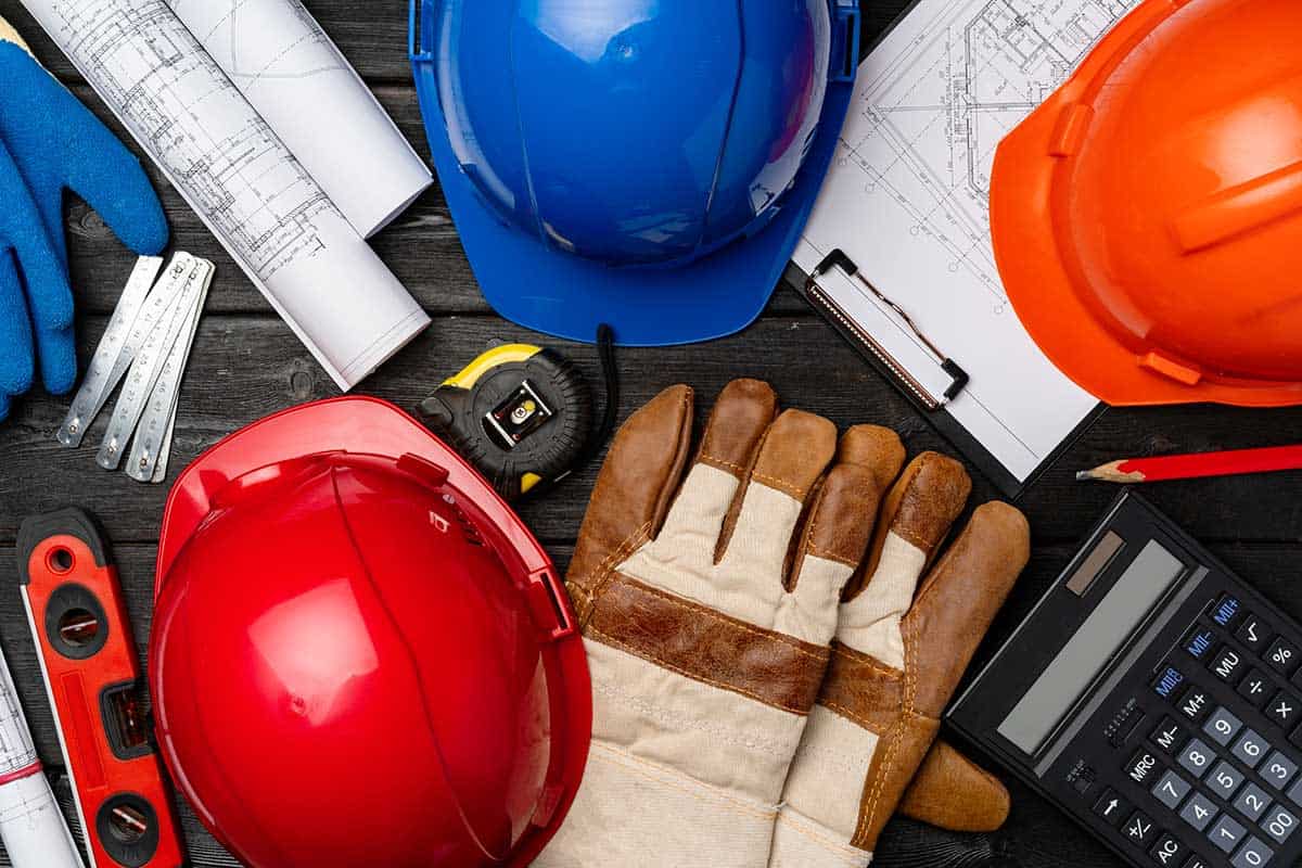 hardhat-gloves-and-blueprints-of-a-builder-2021-12-09-11-41-50-utc